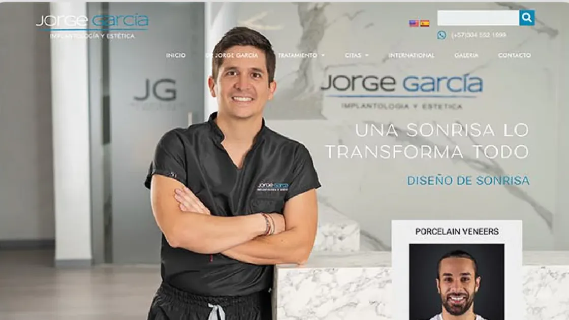 Captura de la portada de Jorge García Odontología, con selector de idioma, WhatsApp y menú de citas.